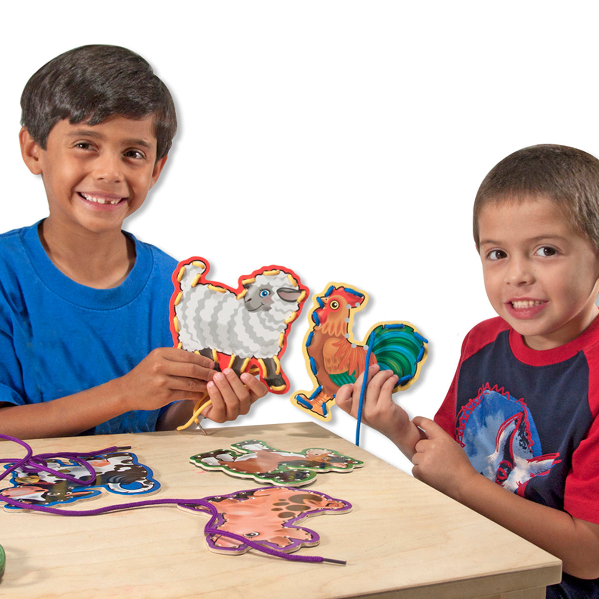 Lace & Trace Farm Wooden Lacing Set with colorful animal panels being used by two children