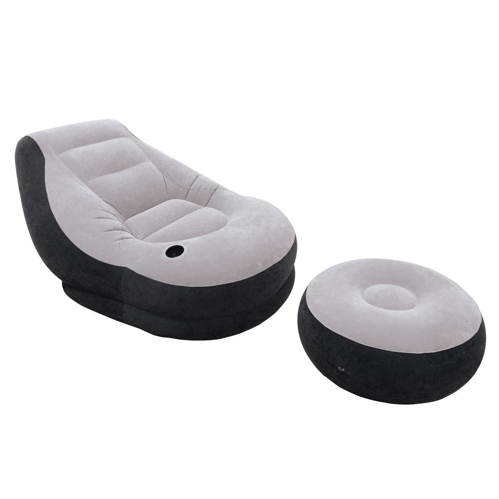 Gray and black inflatable lounge chair with matching ottoman on plain background