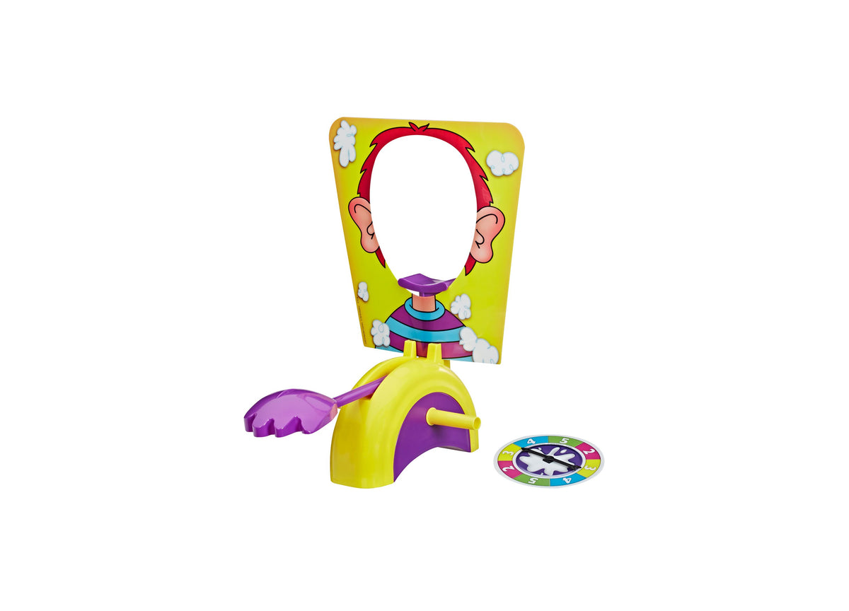 Hasbro Gaming Pie Face Showdown Game with yellow pie thrower, purple accents, colorful spinner, and illustrated chara...