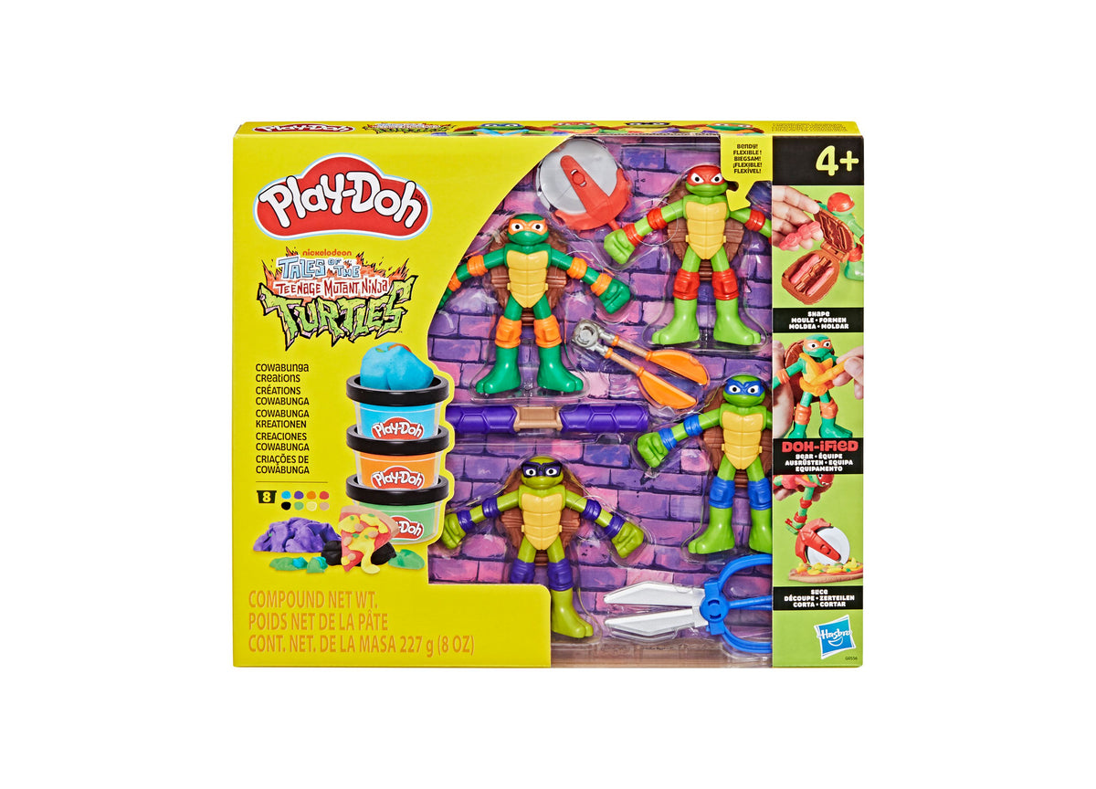 Play-Doh TMNT Cowabunga Creations Playset with four Ninja Turtle figures, purple brick backdrop, Play-Doh cans, and s...