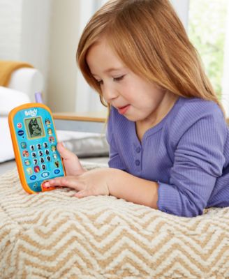 VTech Bluey Ring Ring Phone Interactive Toy in blue and orange with girl playing