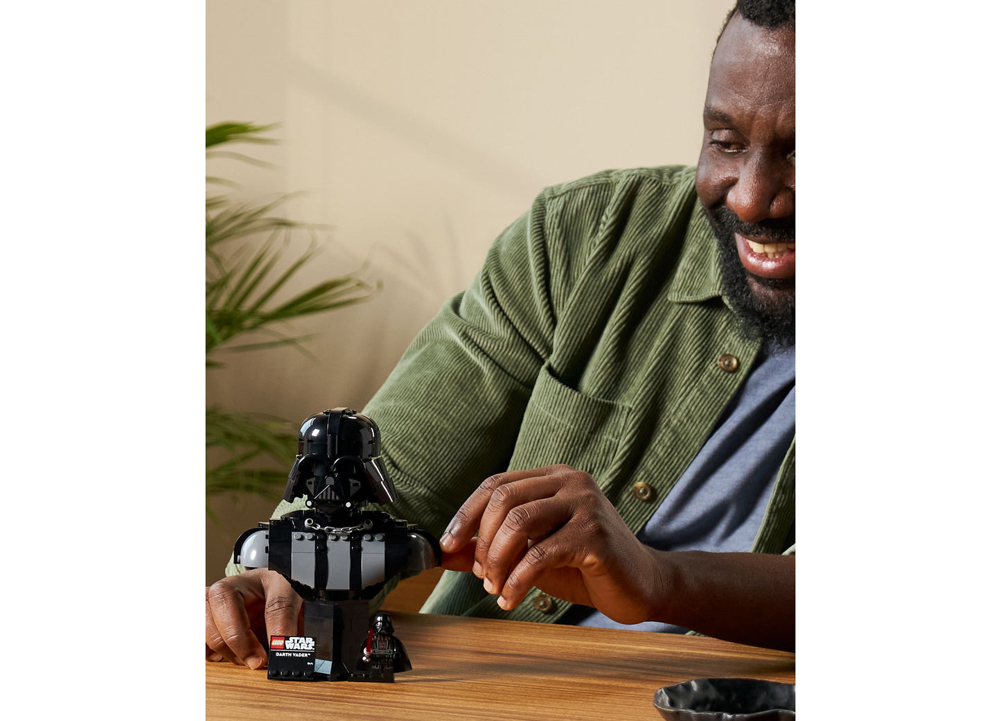 LEGO Star Wars Darth Vader Bust 75439 black building set displayed on wooden table