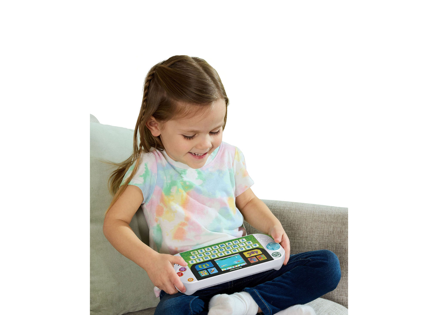 LeapFrog My First Gamer toy with colorful keyboard and screen, held by smiling child
