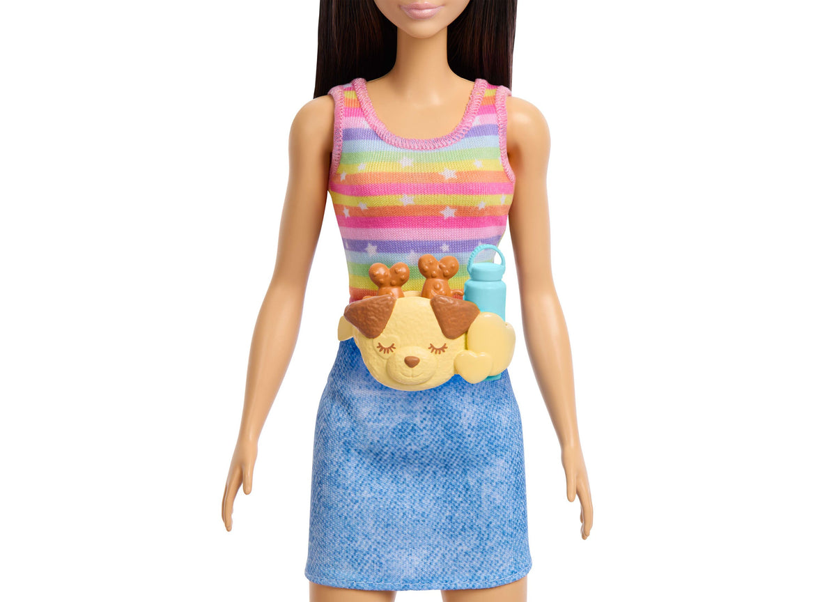 Barbie Skate and Run doll wearing rainbow striped top and blue skirt with puppy character accessory