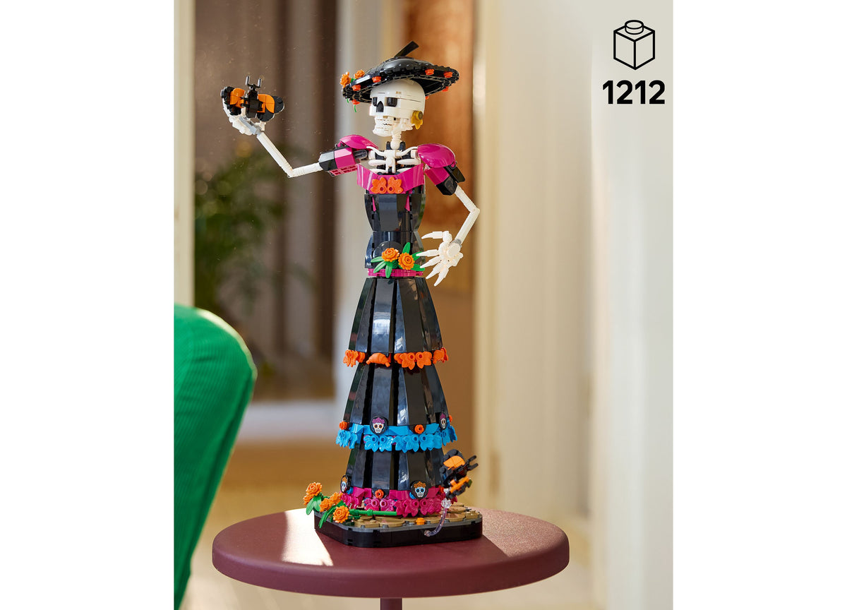 LEGO Ideas Day of the Dead La Catrina skeleton figure with poseable arms, colorful marigold decorations, and mo...