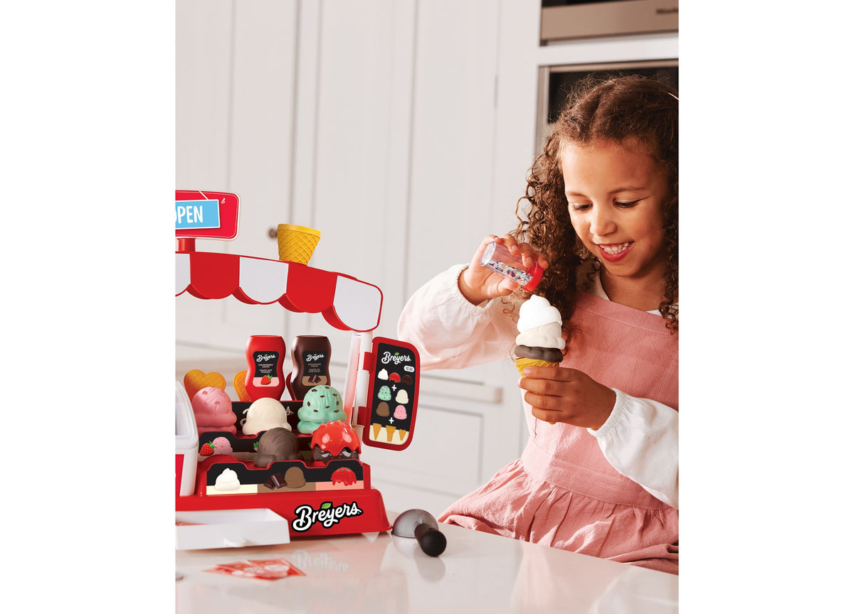 Casdon Ice Cream Parlor playset with red storefront, freezer display, and 35+ pieces including ice cream scoops and a...