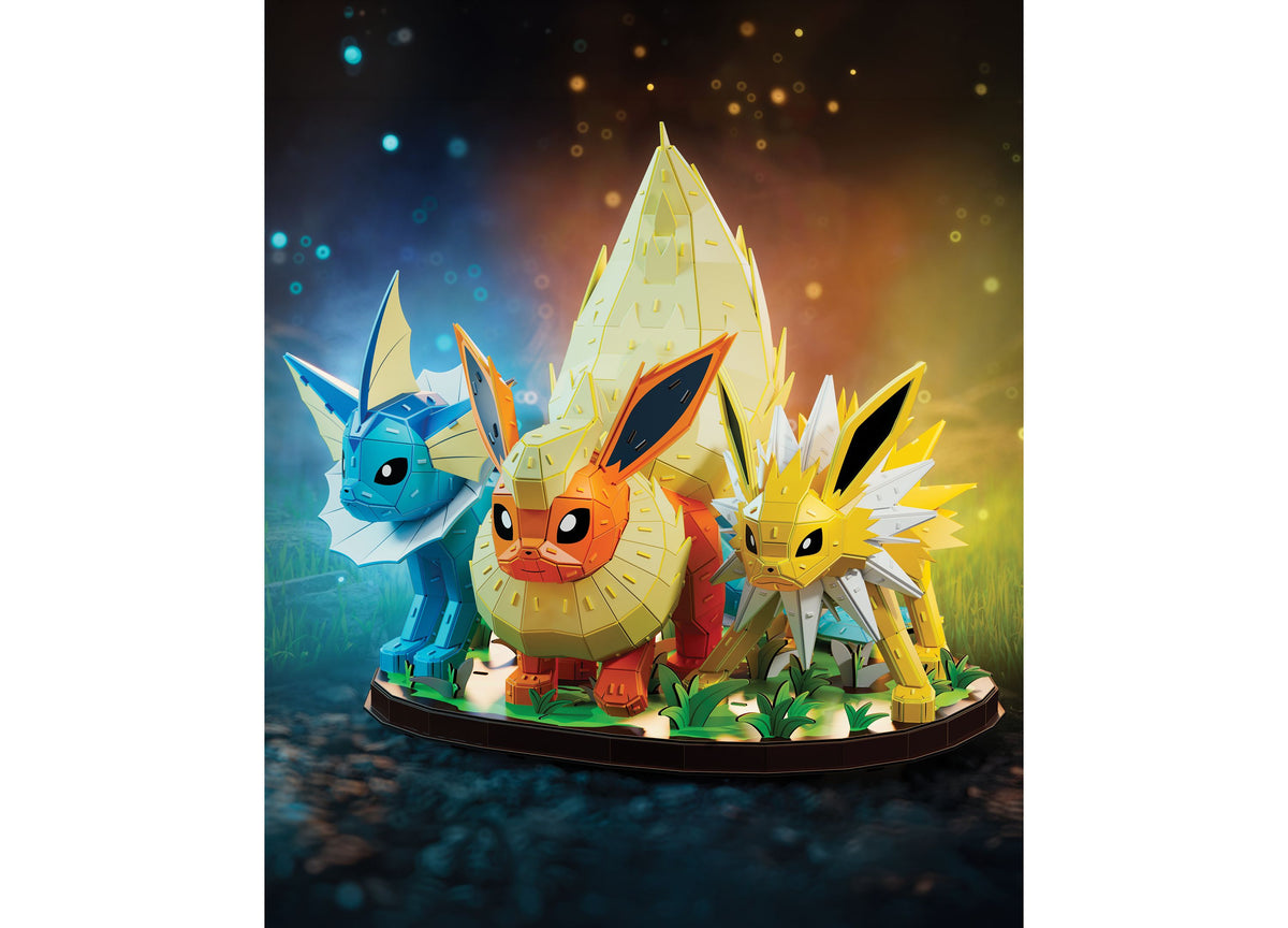 Pokemon Eevee Evolution Trio 612-Piece 4D Puzzle featuring blue Vaporeon, orange Flareon, and yellow Jolteon on grass...