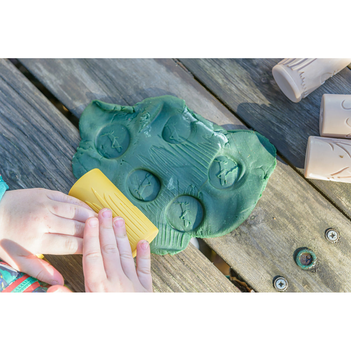 Let's Roll Garden Bugs Clay & Dough Stamper Set with green bug-shaped stamper and yellow tool