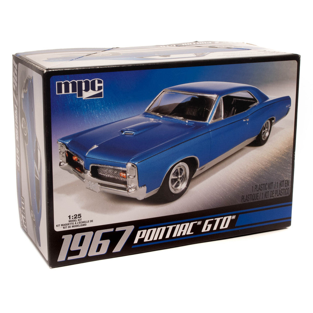 MPC 1967 Pontiac GTO 1:25 scale plastic model kit box showing assembled blue muscle car on display