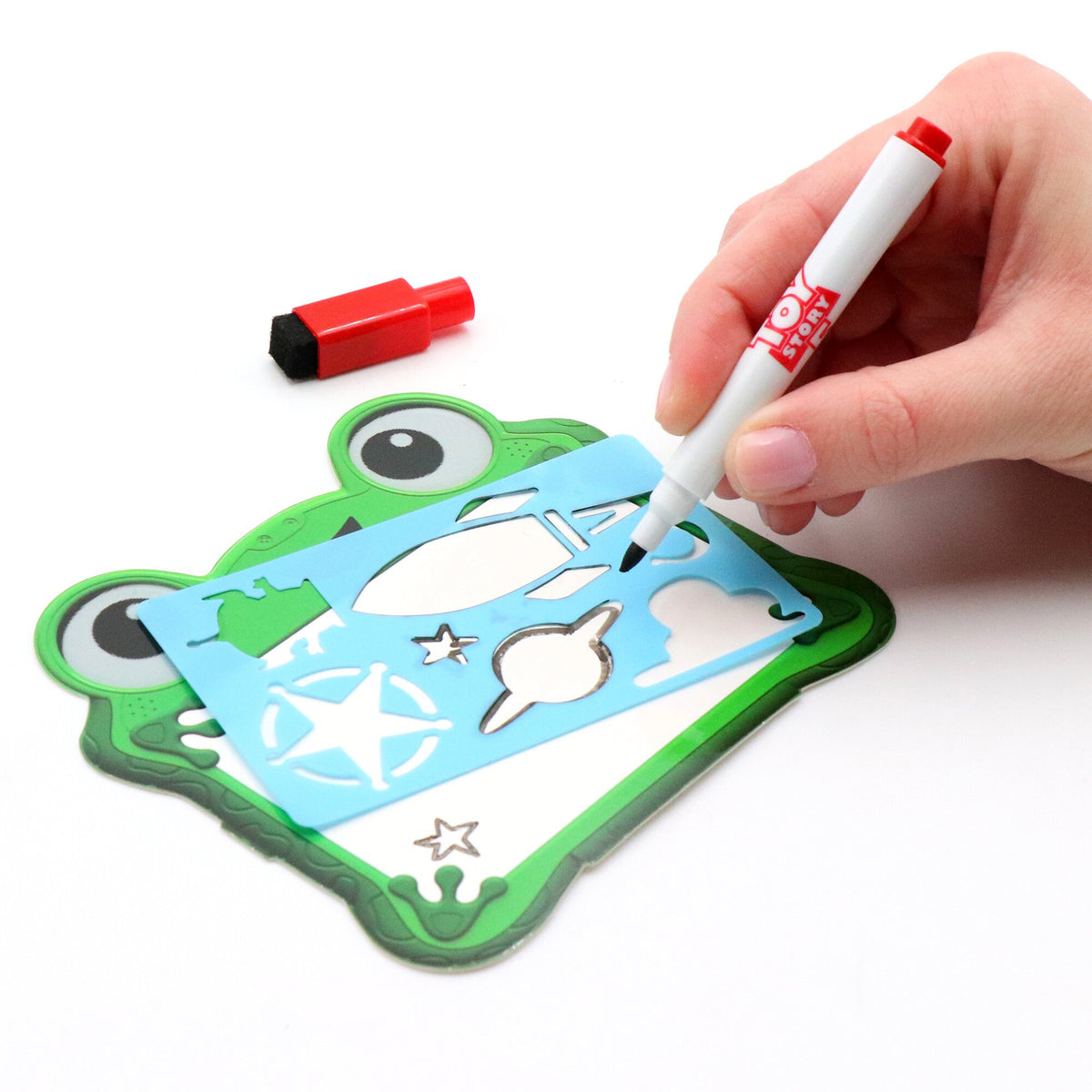 Toy Story 5 Creativity Set with green frog-shaped board, blue insert, red and white marker, and googly eyes