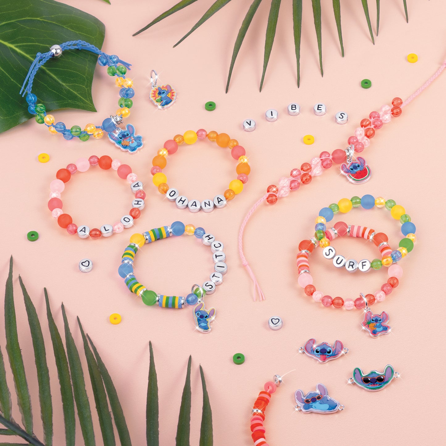 Disney Stitch DIY jewelry kit with colorful beaded bracelets featuring letter beads and Stitch charms on pink background