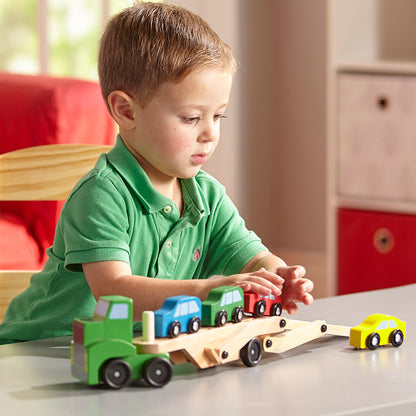 Melissa & Doug Wooden Car Carrier Truck with 4 colorful wooden cars in green, blue, red, and yellow