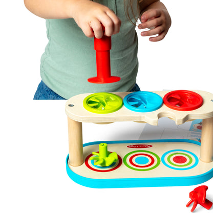 Melissa & Doug Match & Push Spinning Tops wooden toy with colorful red, blue, and green spinning discs