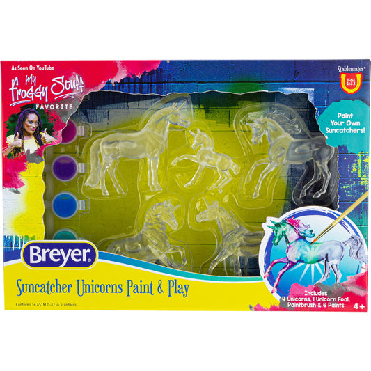 Breyer Suncatcher Unicorns Paint & Play set showing four clear unicorn molds, paint pots in purple and blue, paintbrush, and completed suncatcher example on pac
