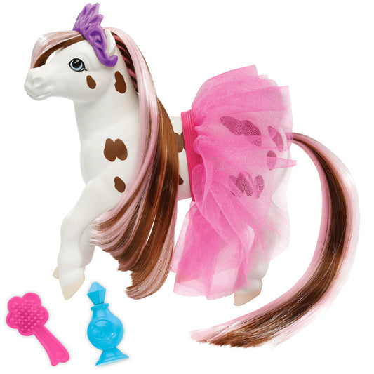 White horse toy with brown spots, pink and brown mane, purple crest, pink tulle skirt, and long brown tail, shown with pink brush and blue perfume bottle access