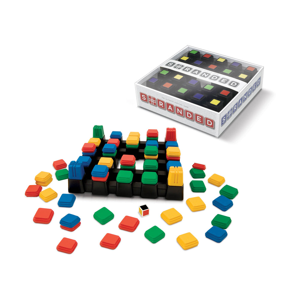Stranded board game showing white box with colored playing pieces arranged on black grid base and loose tiles in red, yellow, green, and blue