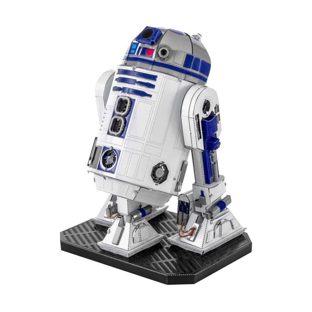 R2-D2 3D metal model kit assembled and displayed on black base, white and blue droid with detailed paneling and articulated legs