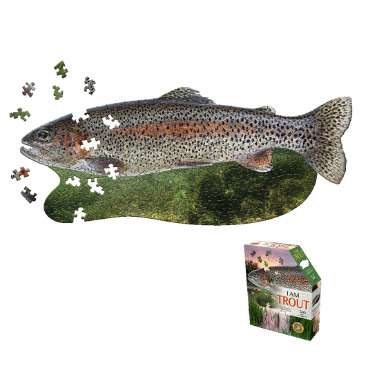 Madd Capp I AM Trout 300-piece jigsaw puzzle shaped like a trout fish, shown partially assembled with loose puzzle pieces displayed to the left and product box