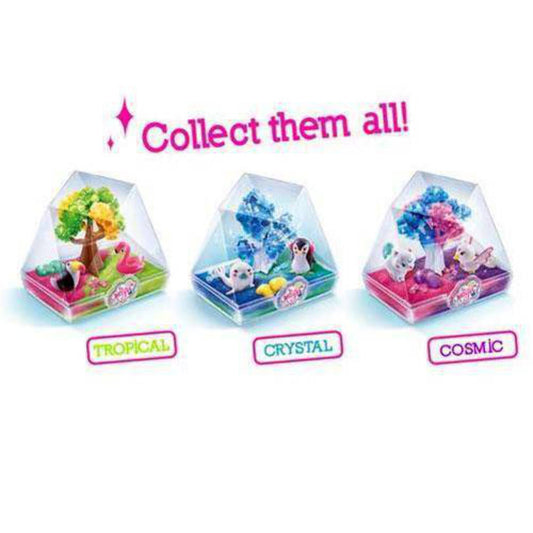 Collect them all! Tropical, Crystal, and Cosmic terrarium kits in clear dome containers with colorful miniature landscapes and animal figures inside