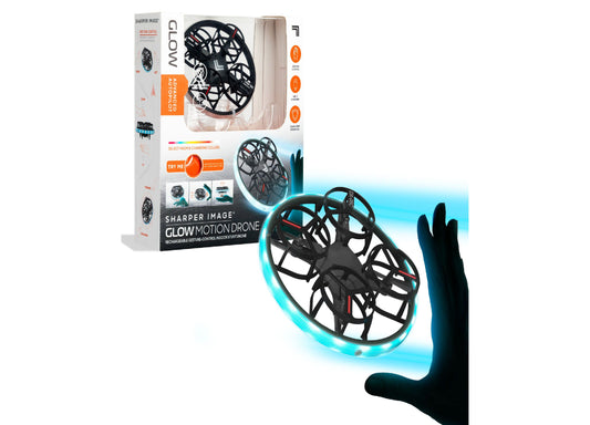 Sharper Image Glow Motion Drone with cyan LED lights, black frame, shown with packaging and hand gesture control