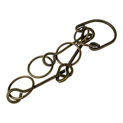 Heavy Metal Puzzle Wrangler brain teaser toy with interlocking bronze rings