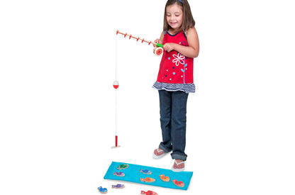 Melissa & Doug Catch & Count Wooden Magnetic Fishing Game with girl playing, red fishing rod, and numbered fish on bl...