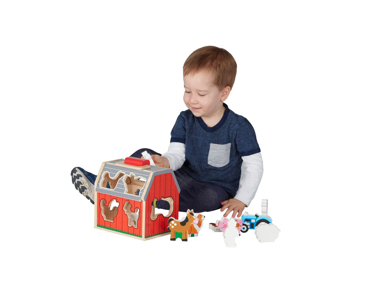 Melissa & Doug Take-Along Sorting Barn with farm animal pieces and tractor toy