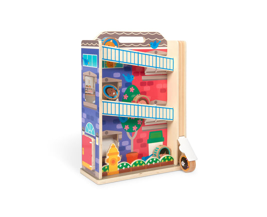 Wooden tower toy with three levels, colorful painted scenes on front including fire hydrant and flowers, blue railings, and rolling wooden ball on right side