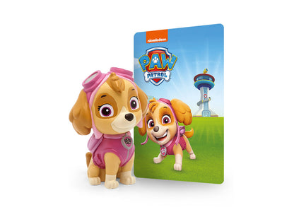Paw Patrol Skye Audio Play Figurine with pink outfit next to packaging showing character and tower