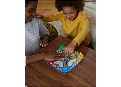 Hasbro Trouble Pop-O-Matic Board Game with colorful pegs and Pop-O-Matic bubble, played by two people