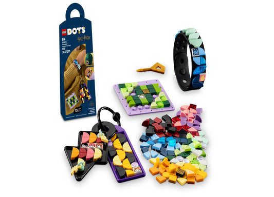 LEGO DOTS Hogwarts Accessories Pack contents displayed: purple and black storage cases with colorful LEGO dots, matching wristband, purple baseplate, colorful t