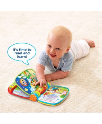 VTech Musical Rhymes Interactive Learning Book with colorful pages and piano keys, baby playing with open book