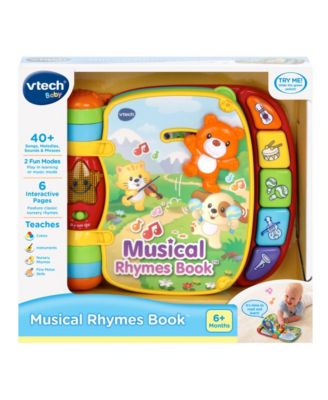 VTech Musical Rhymes Interactive Learning Book with colorful pages, piano keys, and light-up star