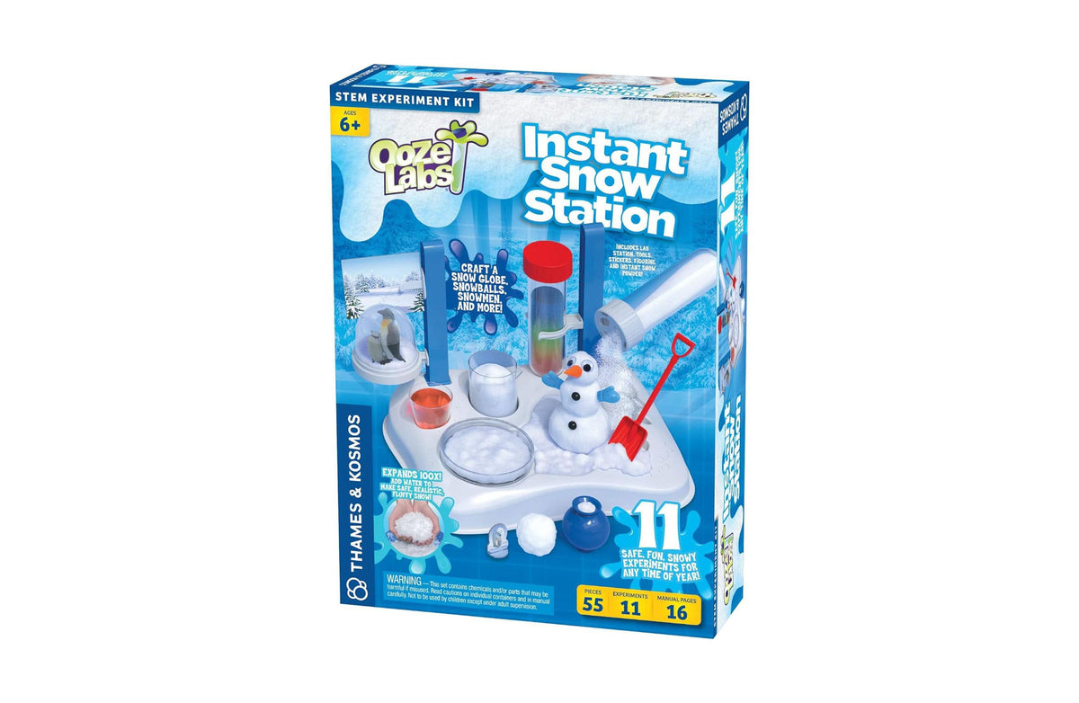 Thames and Kosmos Ooze Labs Instant Snow Station STEM kit with white base station, snowman figure, red shovel, and bl...