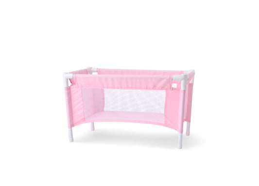 Pink and white doll crib with mesh sides and white legs on plain background