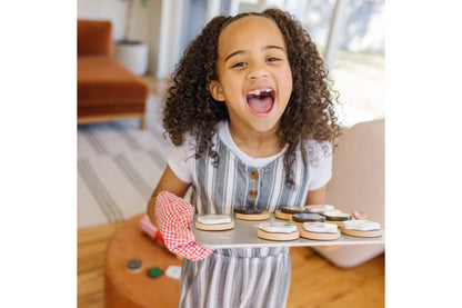 Melissa & Doug Slice and Bake Cookie Set with wooden cookies and red checkered oven mitt