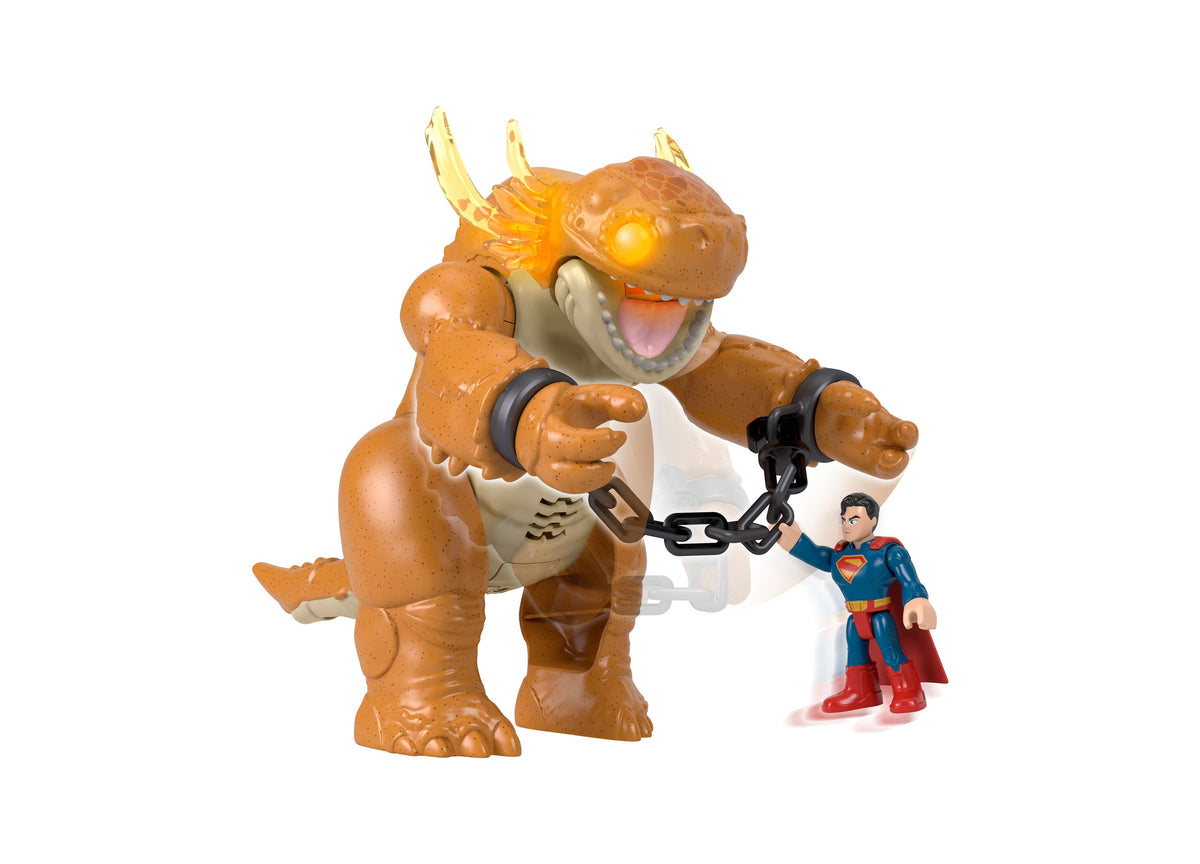Imaginext Superman Kaiju Clash Toy with brown horned monster, glowing eyes, Superman figure, and chain accessory