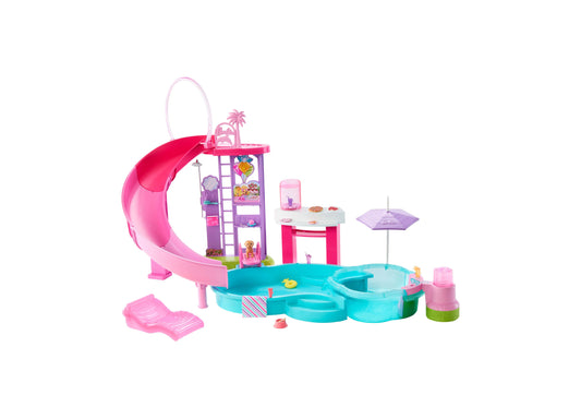 Barbie Dream Pool playset with pink water slide, purple tower building, turquoise pool with hot tub sections, cabana, umbrella, lounge chair, and 20+ accessorie