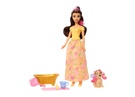 Belle fashion doll wearing yellow off-shoulder top and floral skirt with pink tiara, shown with golden bowl, blue teacup, pink accessories, and tan dog with pin