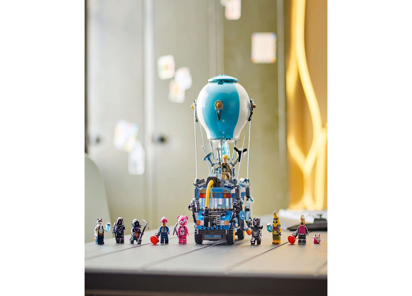 LEGO Fortnite Battle Bus toy set with blue hot air balloon, vehicle base, and minifigures displayed