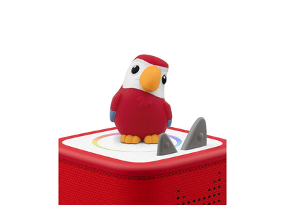 Red parrot figurine with white head and orange beak