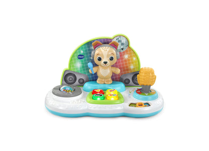 VTech Baby Bark and Bop Dance Party Puppy interactive toy with tan puppy figure, colorful disco ball backdrop, turntable, microphone, and musical buttons on whi