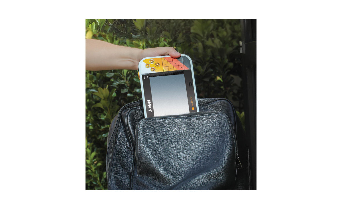 Atari Gamestation Go 7" portable console with 200+ games displayed above black carrying case