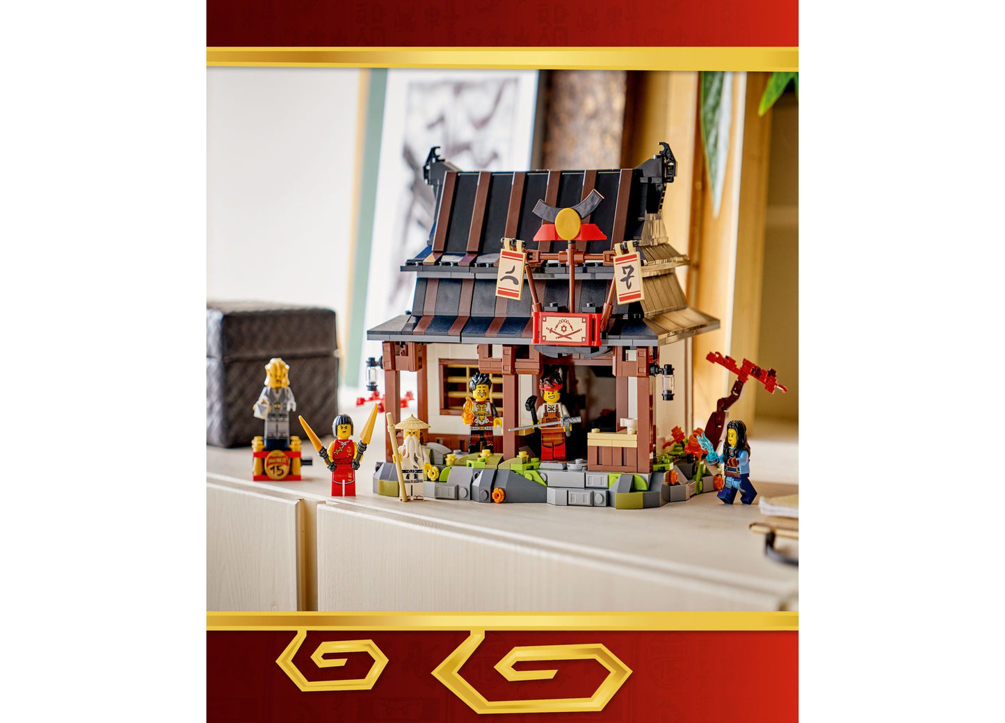 LEGO NINJAGO Four Weapons Blacksmith 15th Anniversary building set with red and brown Asian-inspired structure and mi...