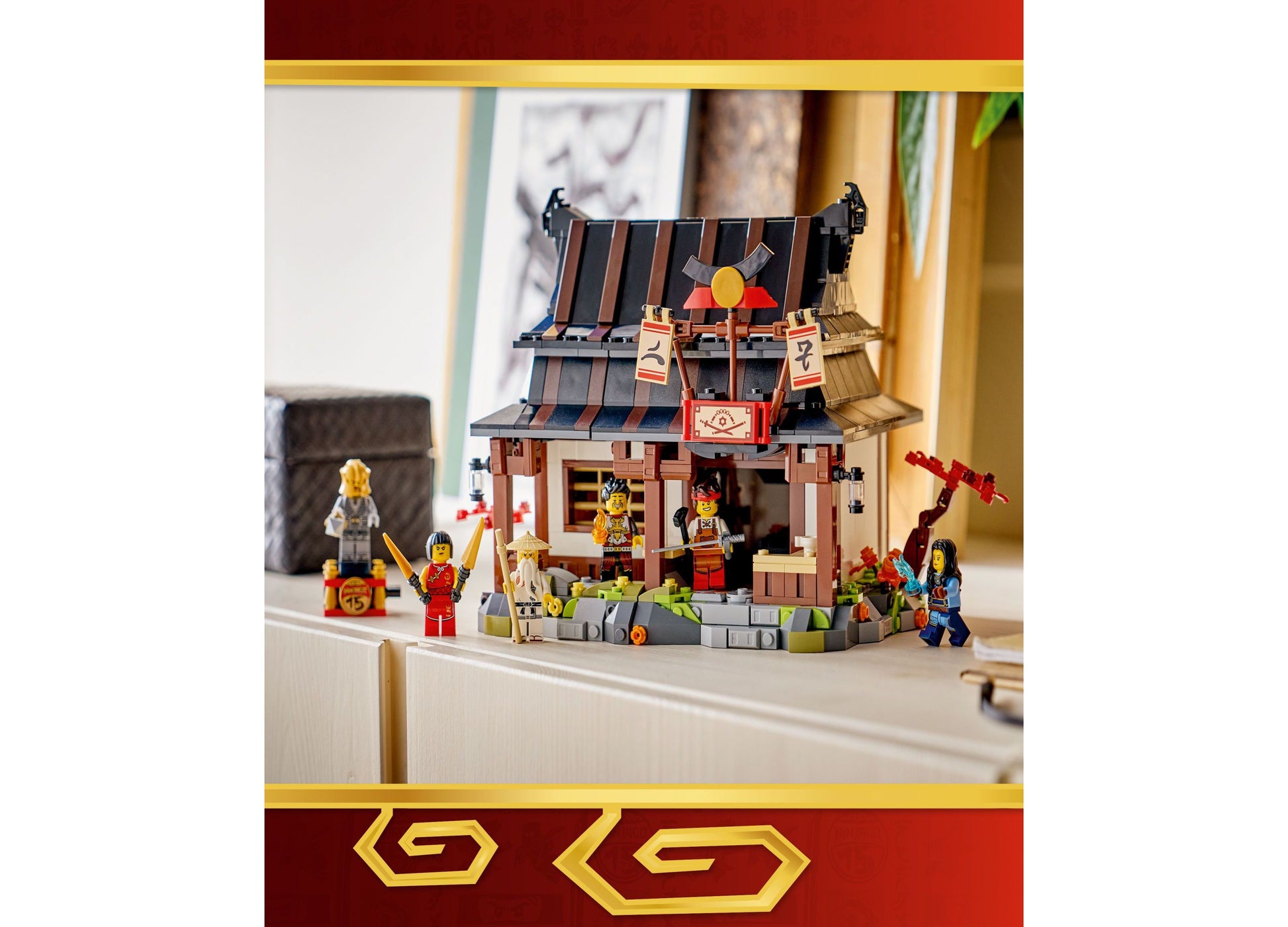 LEGO NINJAGO Four Weapons Blacksmith 15th Anniversary building set with red and brown Asian-inspired structure and mi...