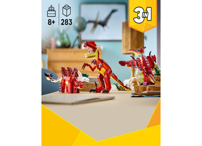 LEGO Creator 3 in 1 Fierce Dinosaur red building toy set with three dinosaur models displayed on desk