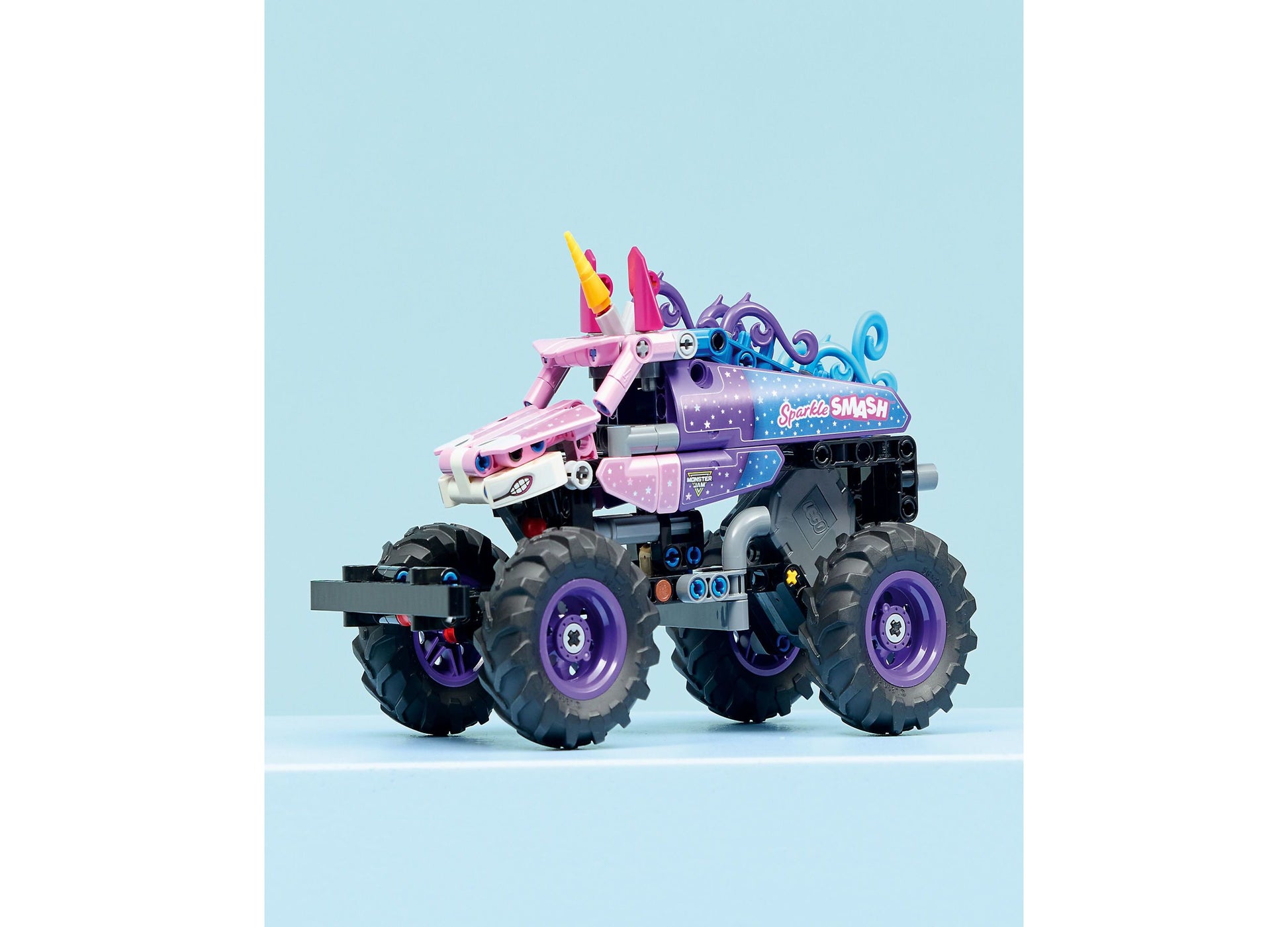 LEGO Technic Monster Jam Sparkle Smash pull-back truck with pink unicorn head, purple wheels, and star design