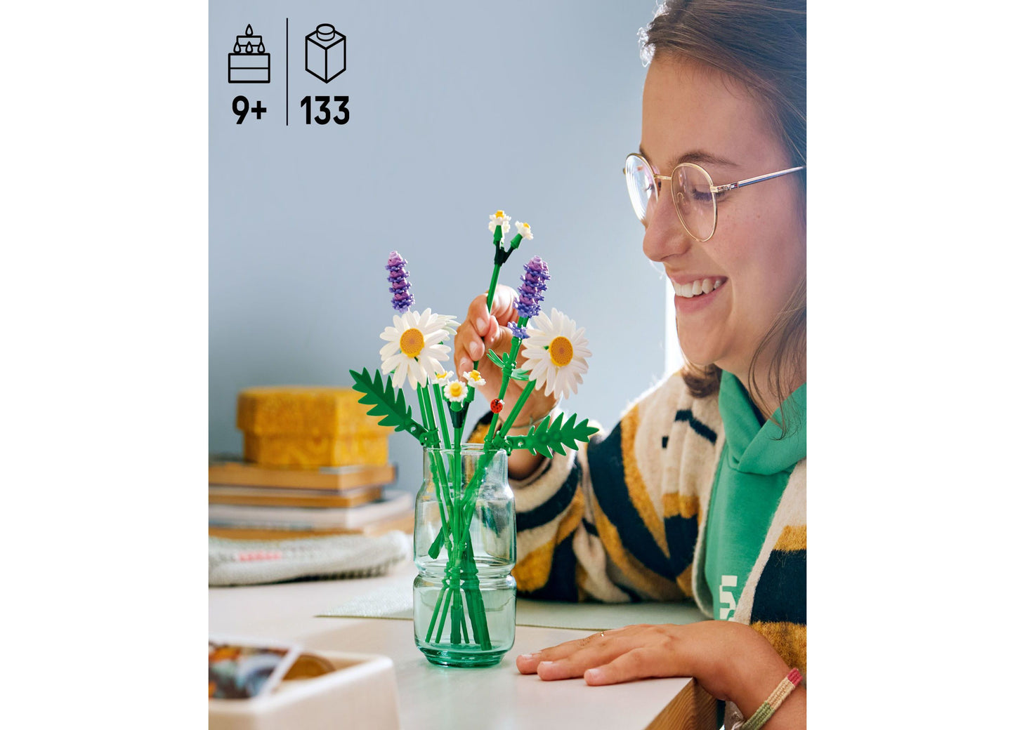 LEGO Botanicals Daisies 133-piece building set with white daisies, purple flowers, and green stems in glass vase