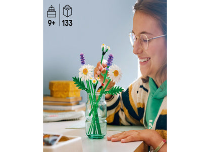 LEGO Botanicals Daisies 133-piece building set with white daisies, purple flowers, and green stems in glass vase