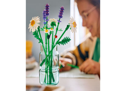 LEGO Botanicals Daisies building toy set with white and purple flowers in glass vase